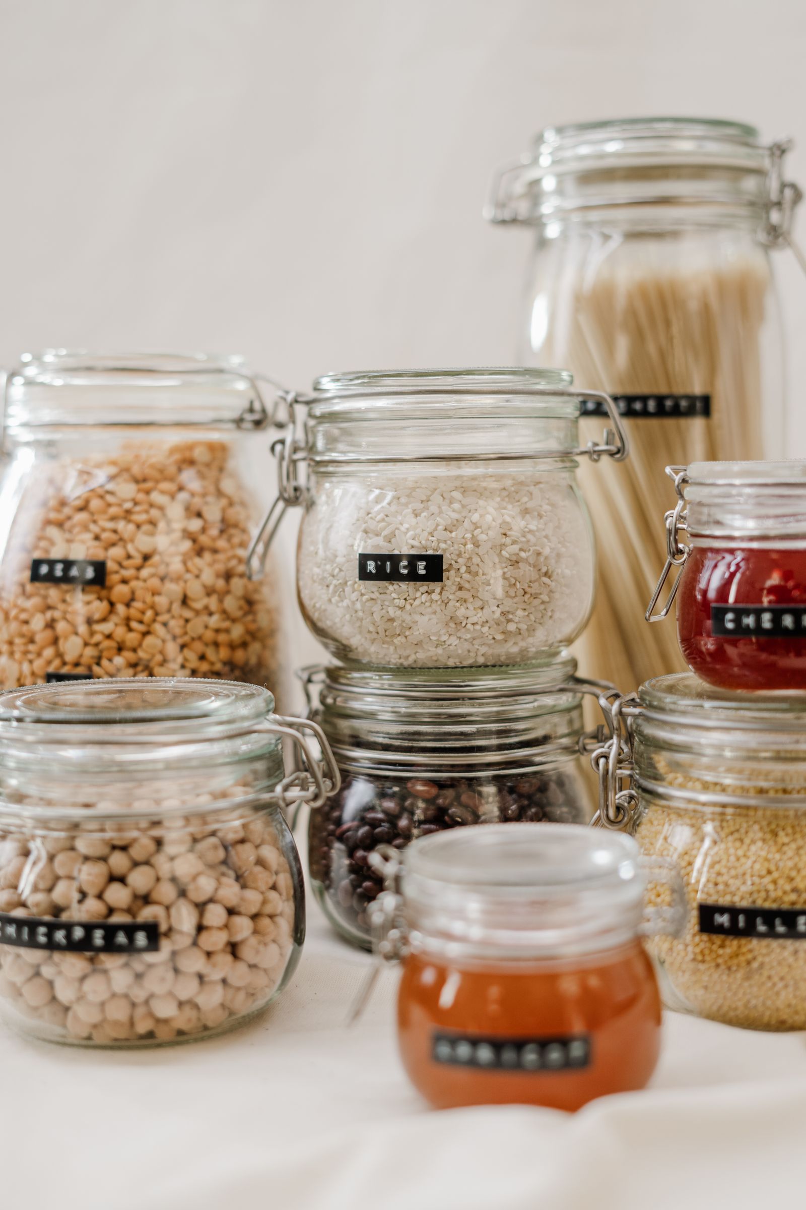 Organized pantry jars and specialty grocery staples